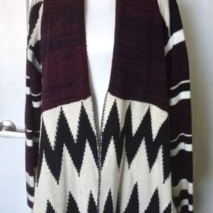 Burgundy, black, and cream sweater